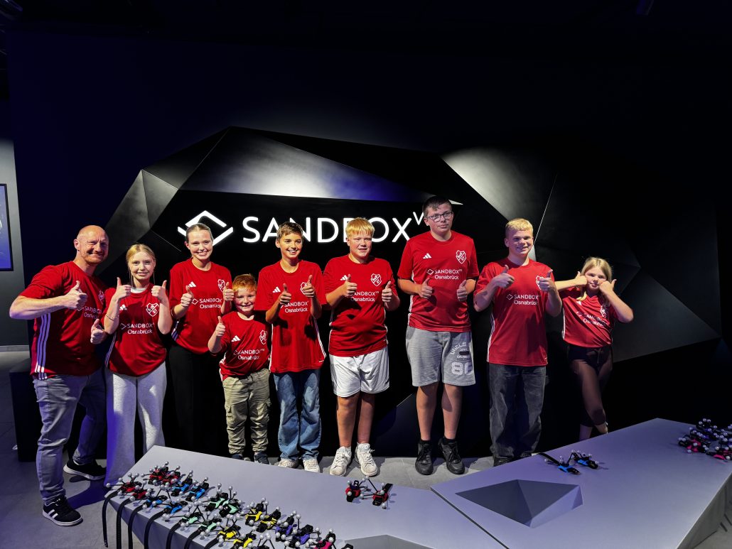 SuS Buer in roten Trikots mit Sandbox-VR-Osnabrück-Logo